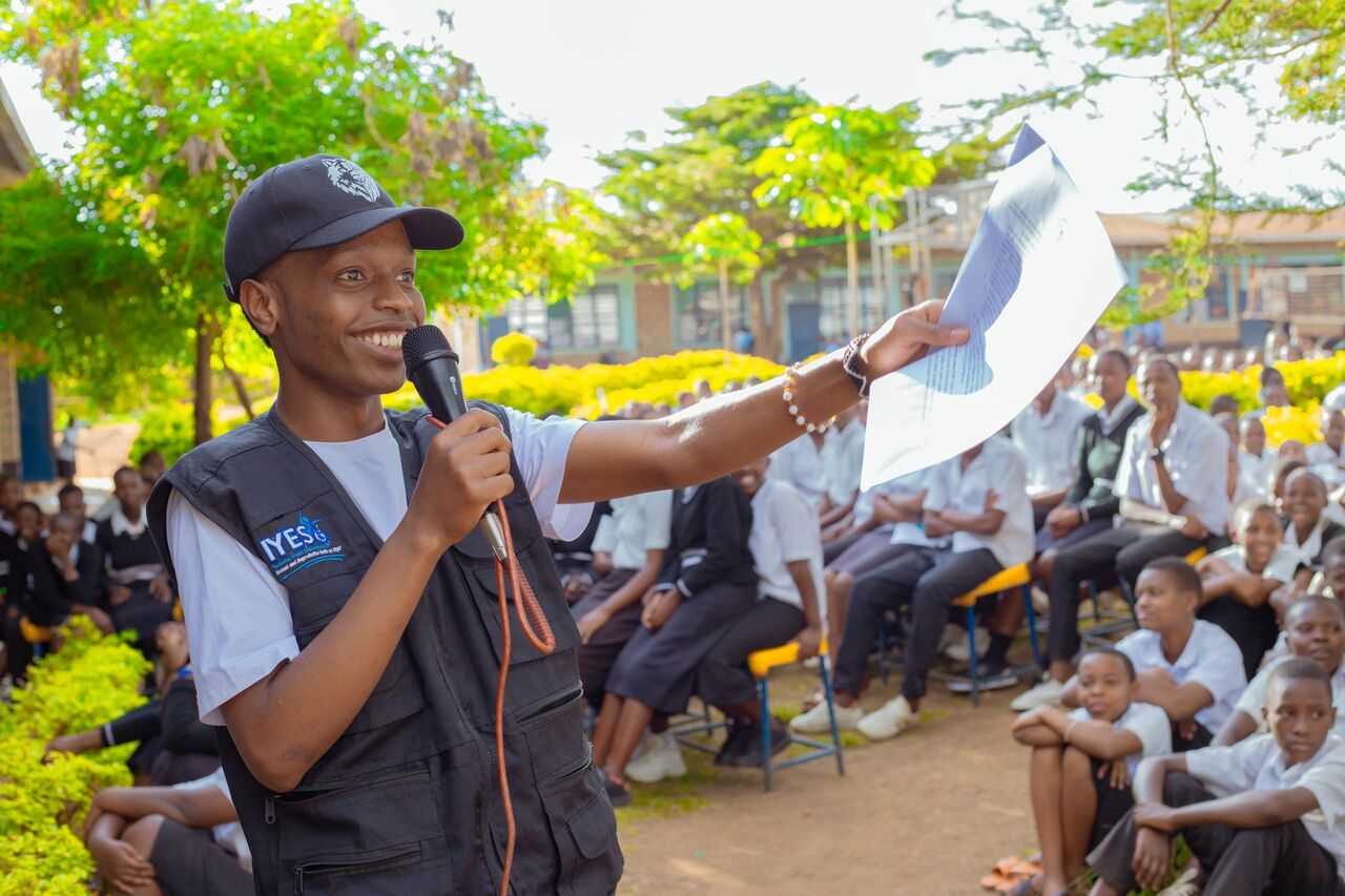 IYES youth volunteer engaging students – Rwanda